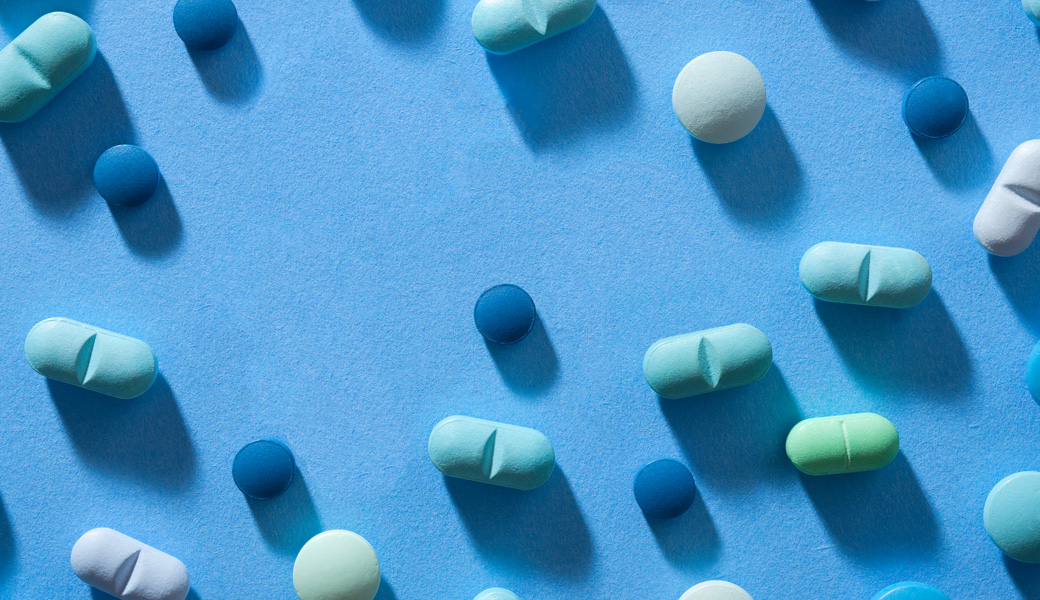 Top view of pills lit with harsh light